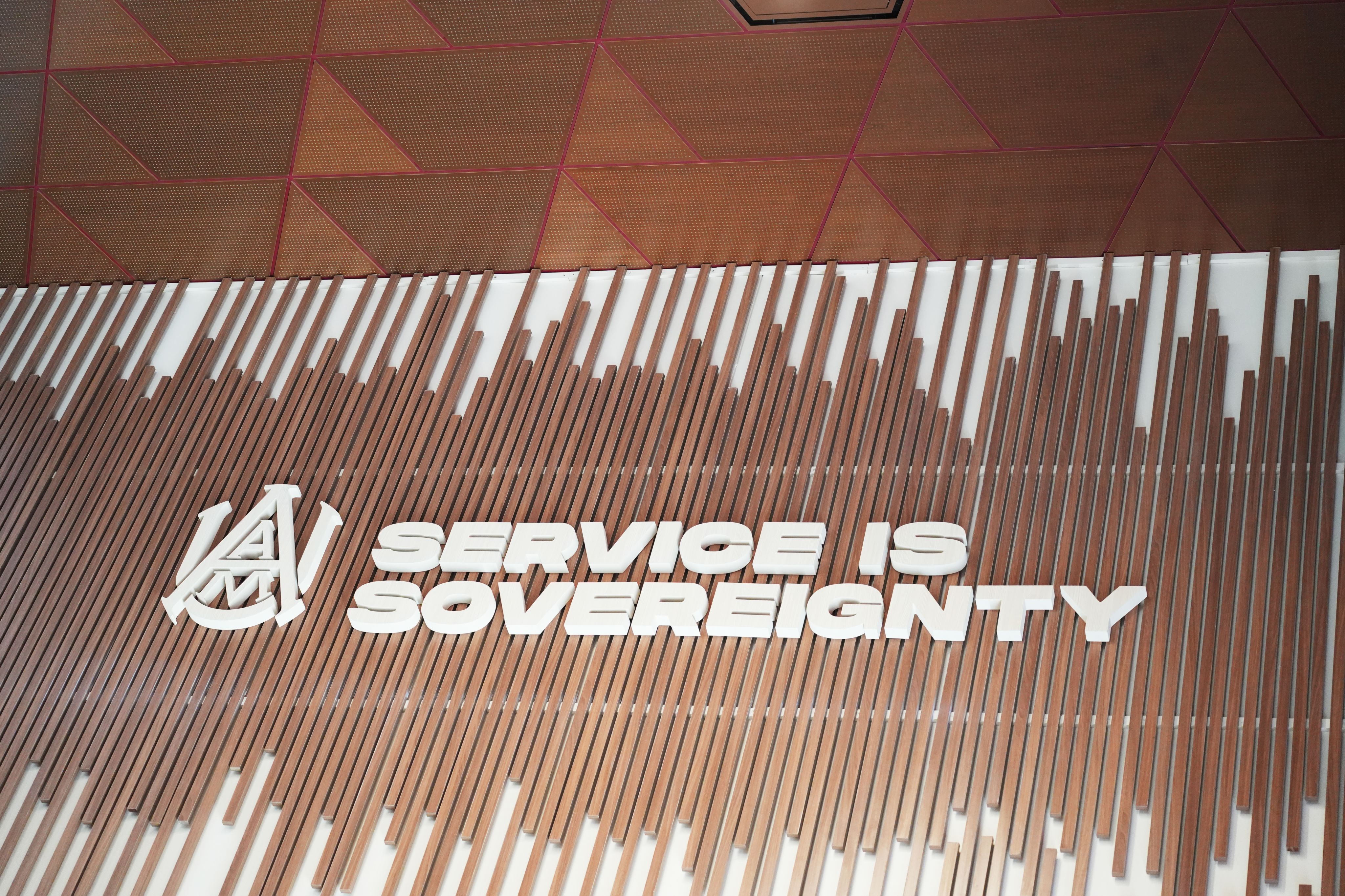 A sign with the words, "Service is sovereignty."