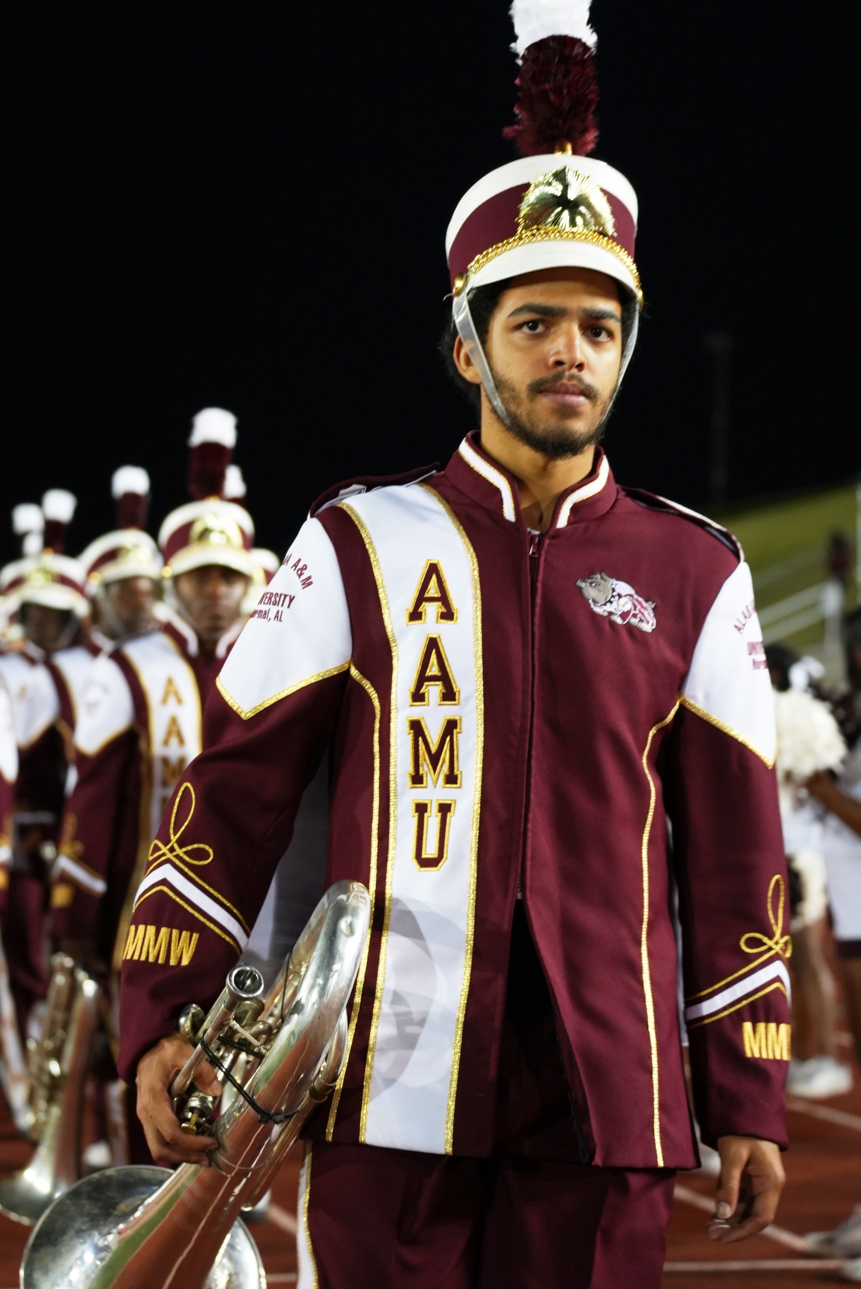 A member of Alabama A&M's marching band looking ahead with focus.