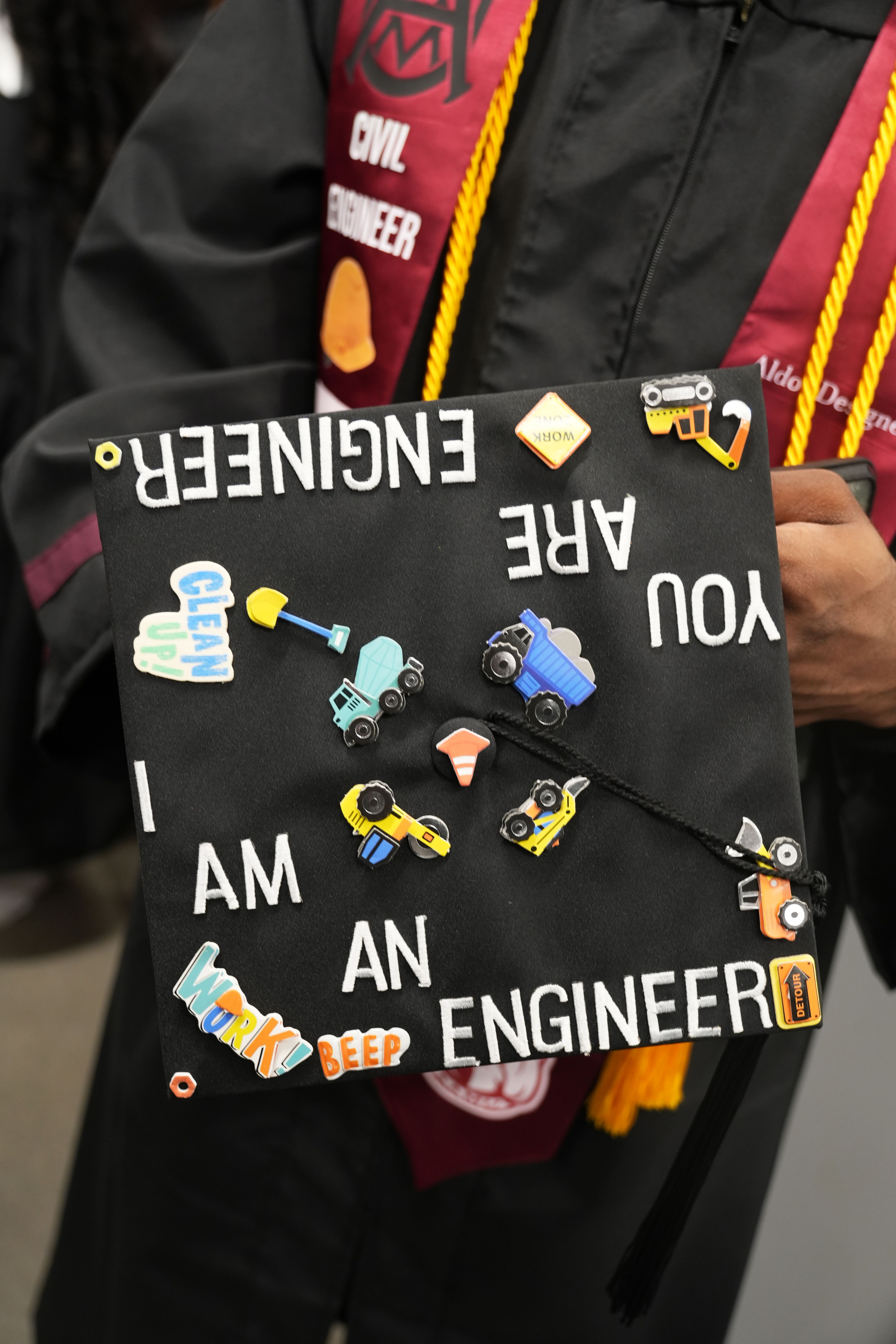 The top of a student's graduation cap with the words, "I am an engineer."