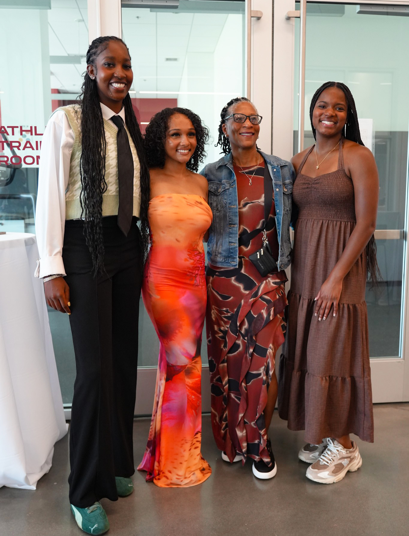 Three AAMU students join a guest at the Sundresses and Sneakers Social