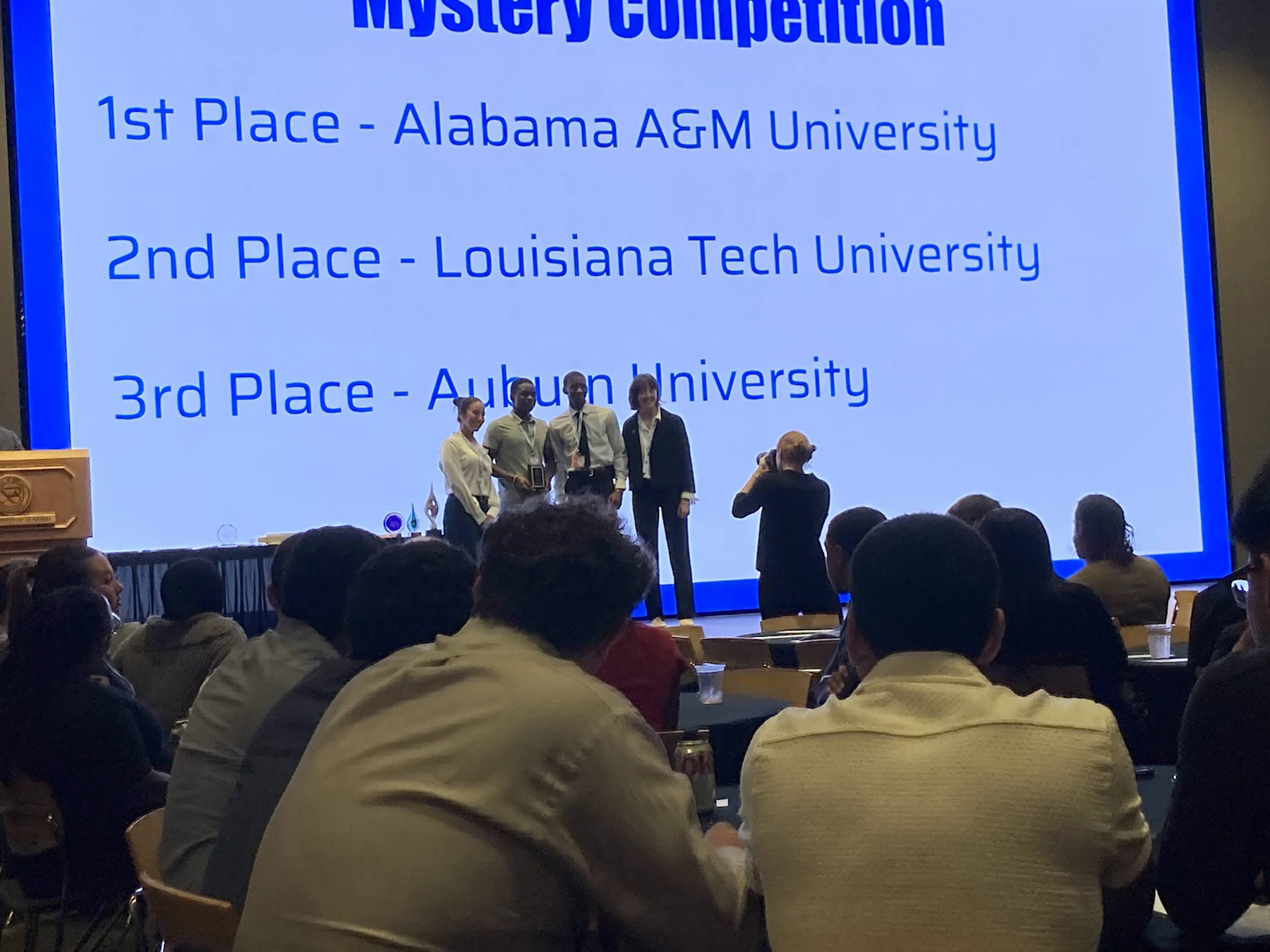 Two AAMU students on starge accepting first place award for ASCE Mystery Challenge