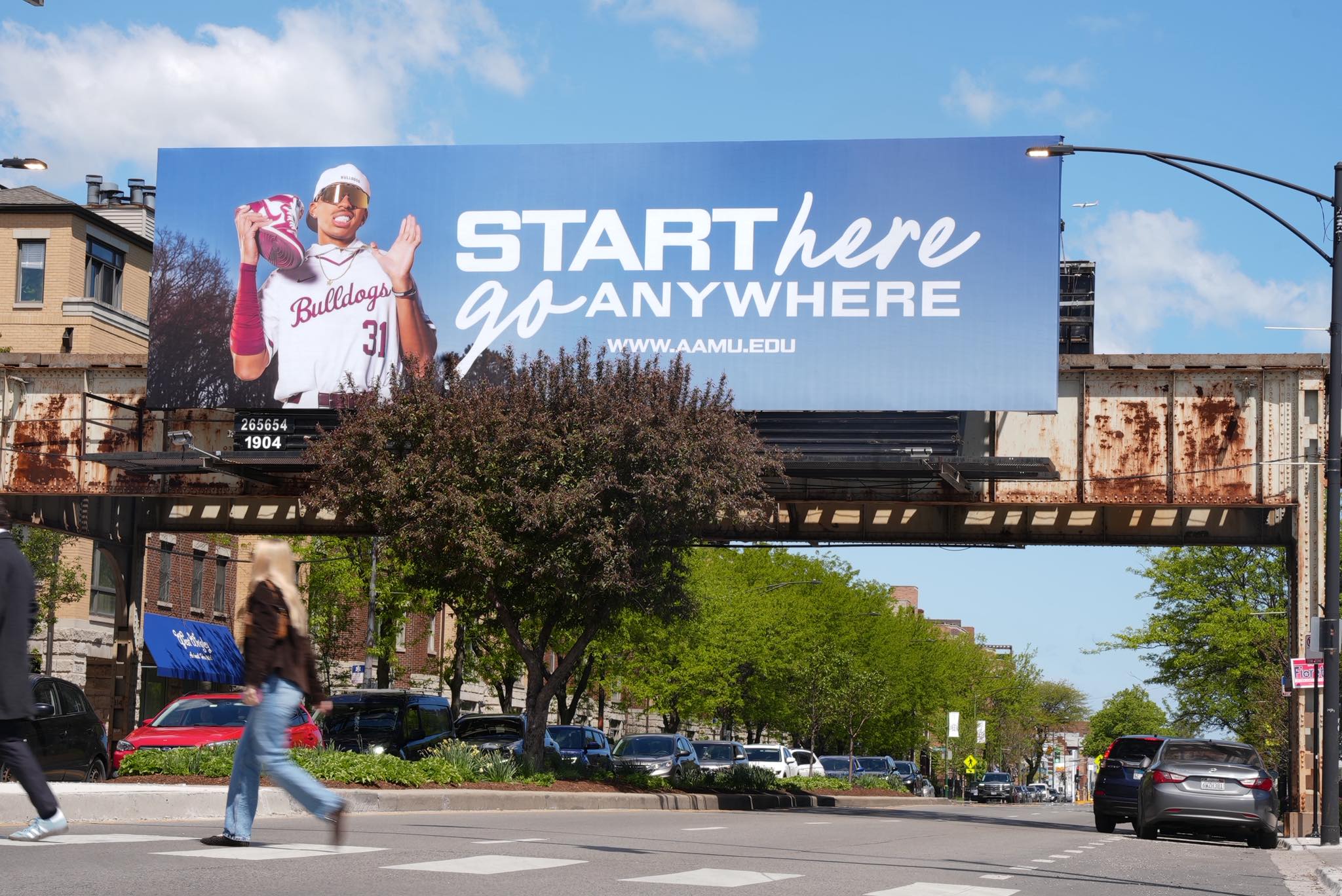 AAMU Billboard shows baseball player and states "Start Here, Go Anywhere" on CTA at West Roscoe and Ashland