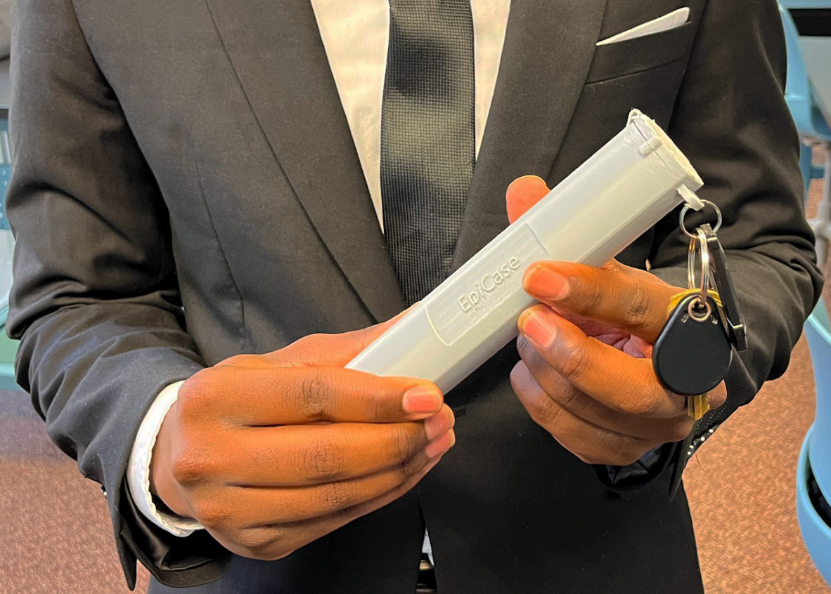 Close up photo of Mubanga's EpiPen case