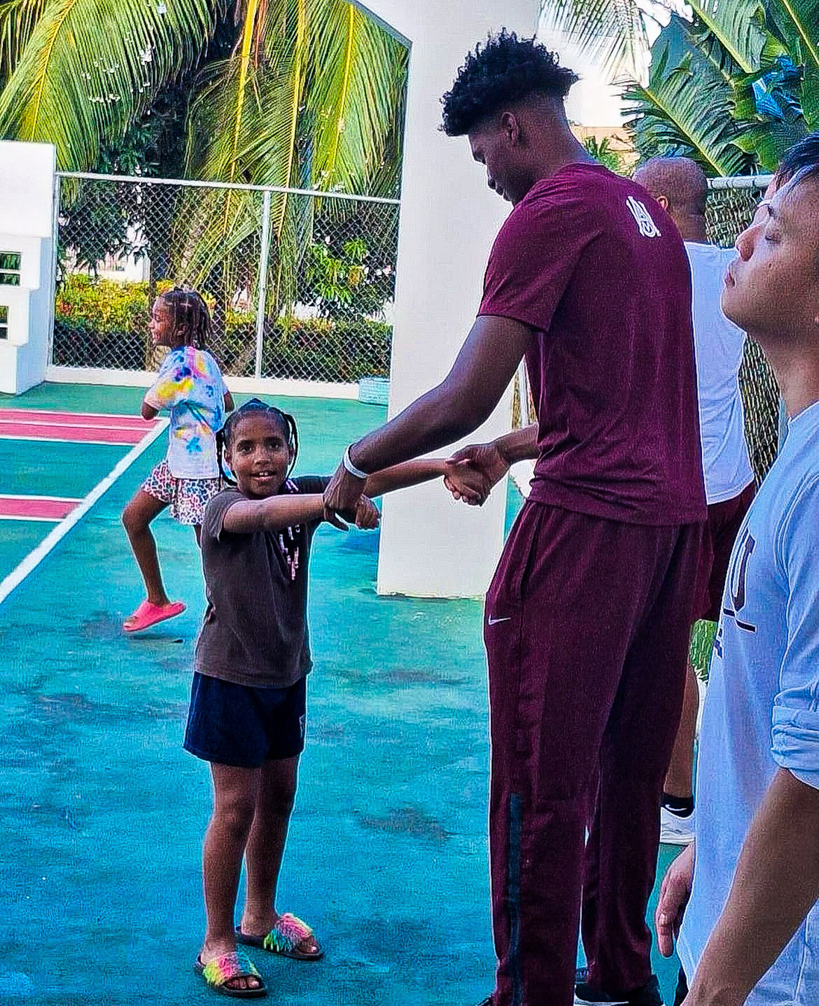 Bulldog Plays with Little Girl in Dominican Republic