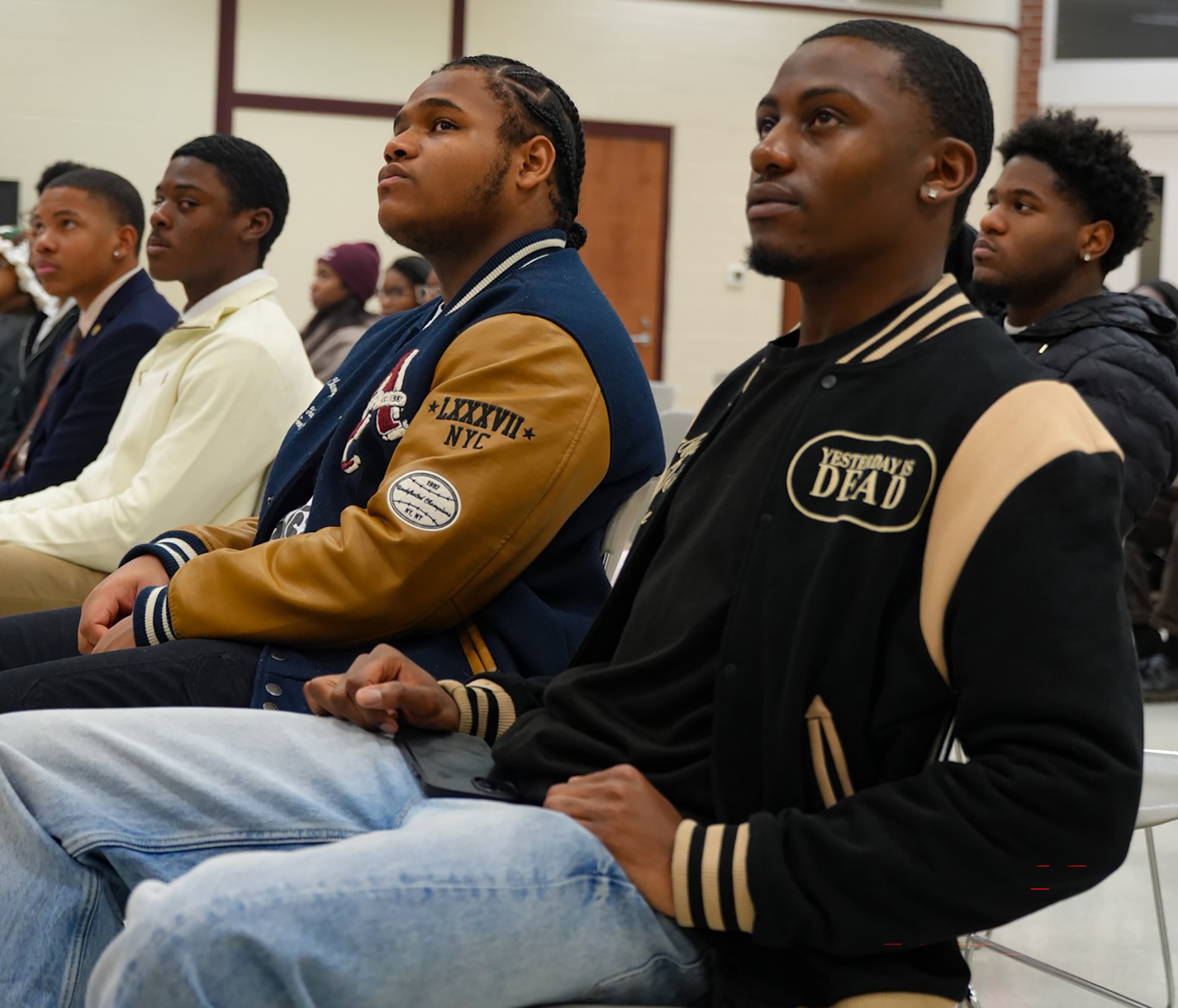 Male students listen to panel on chivalry