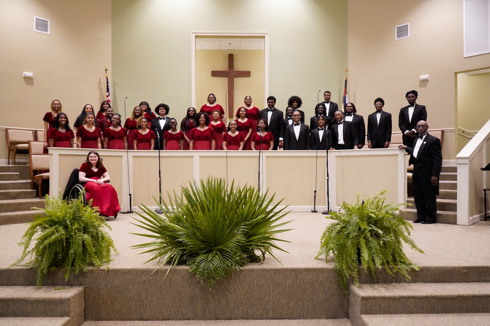 AAMU Choir pose for photo on stage at Church Street Cumberland Presbyterian
