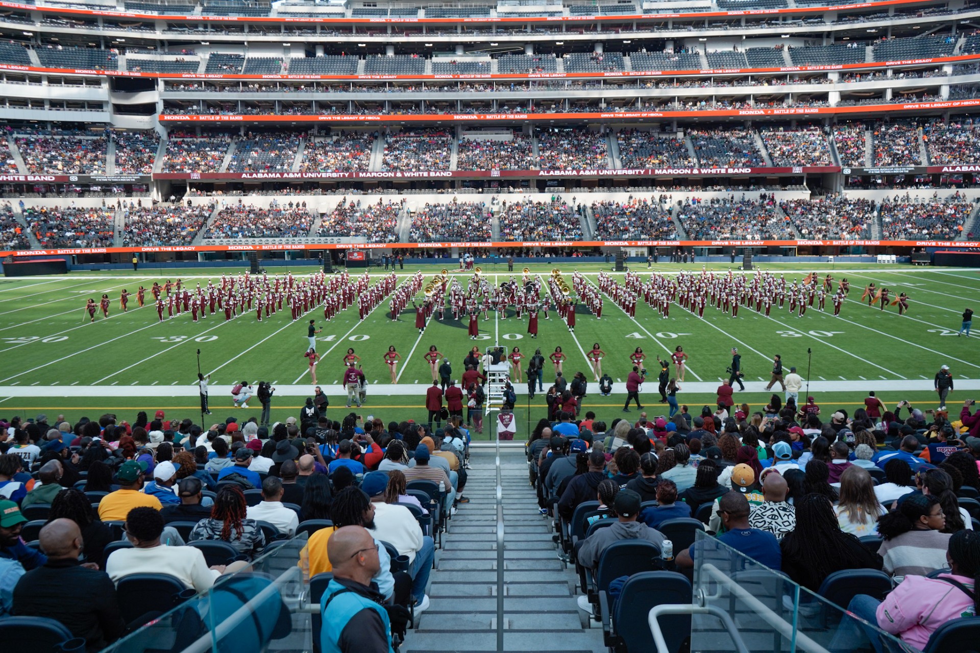 50 yard line shot of the entire AAMU MMW Band on the field at SoFi Stadium in California