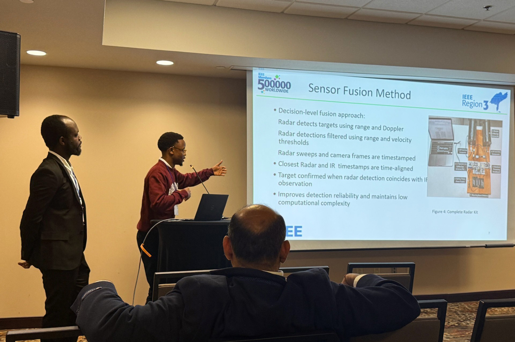 Kwenda-Munashe points at slide during presentation