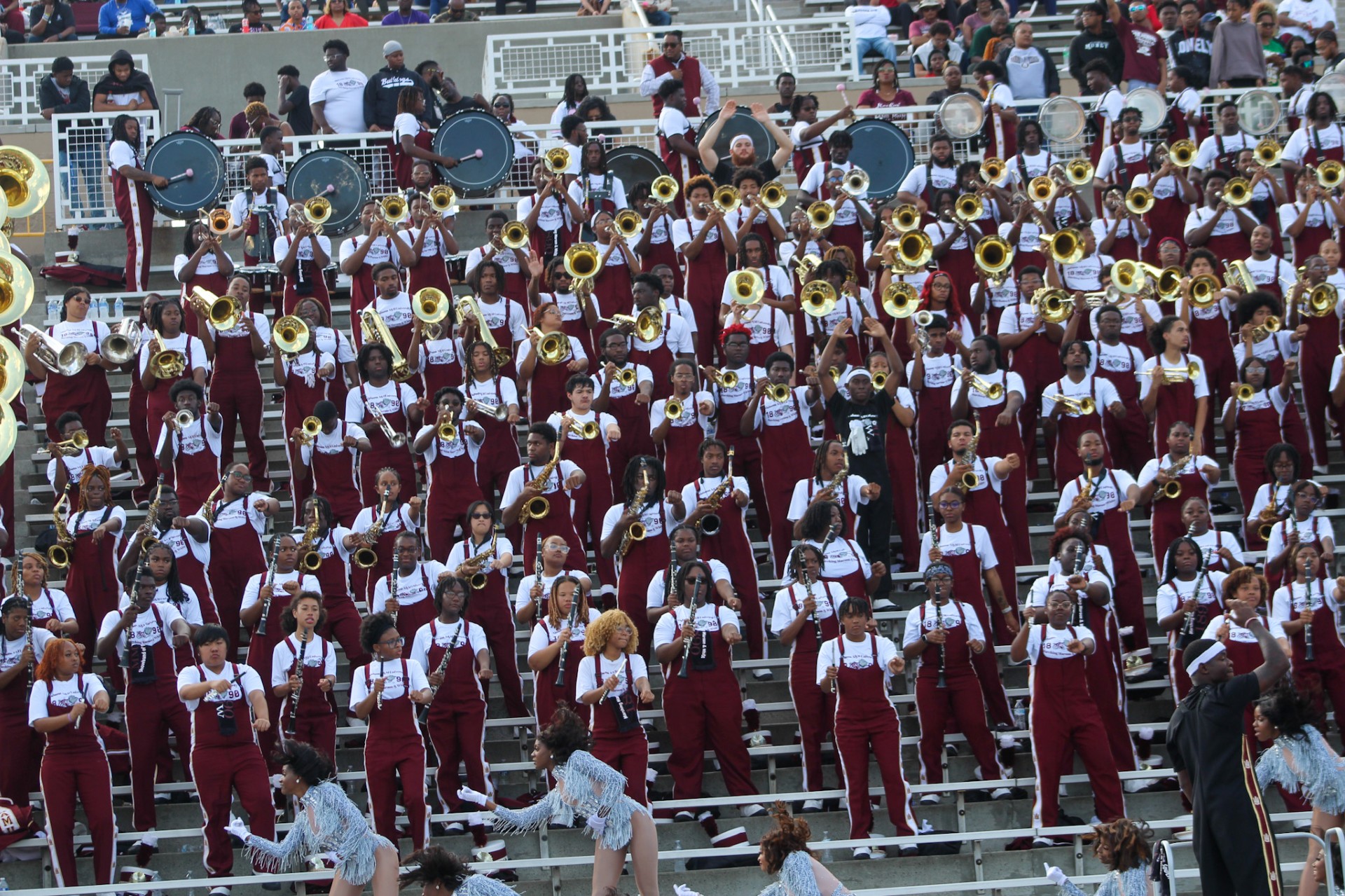 Jackson in the fourth row from the bottom and fourth person from the left performing with the MMW from the seats of Louis Crews Stadium