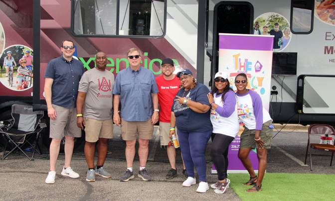 extension staffers at legacy center event