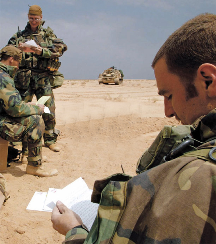 Soldiers reading letters