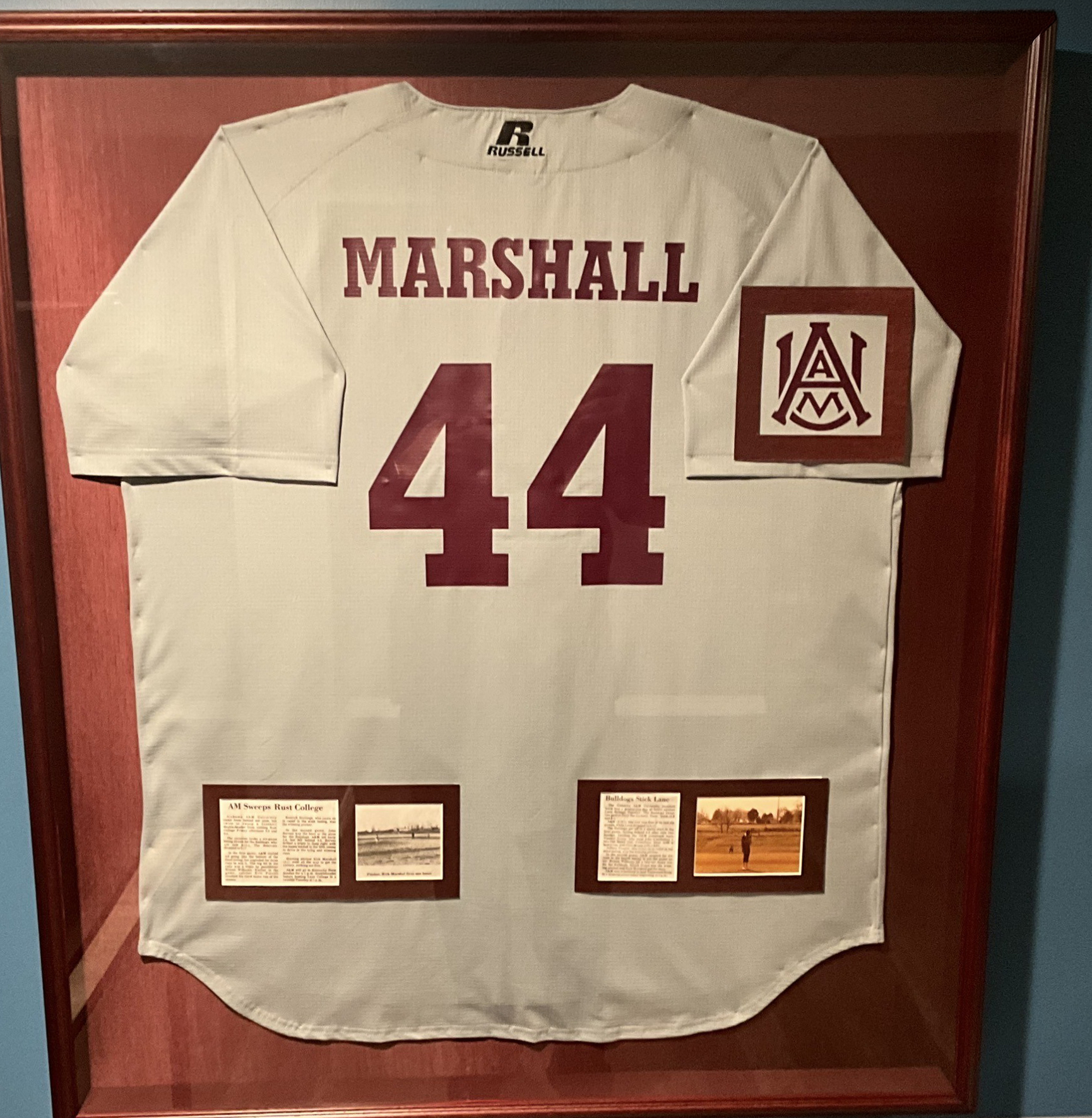 Marshall's framed jersey hanging on his wall