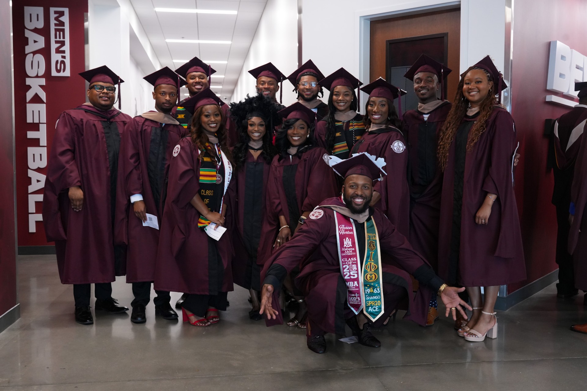 Group of AAMU masters students pose and smile at the event center