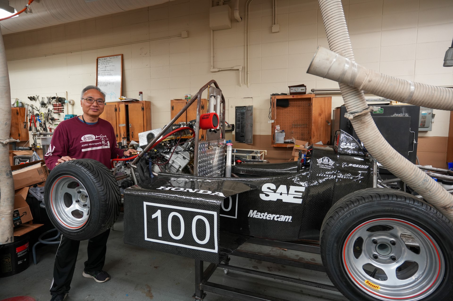 Dr. Wing Chan with AAMU's 2023 Formula SAE Car