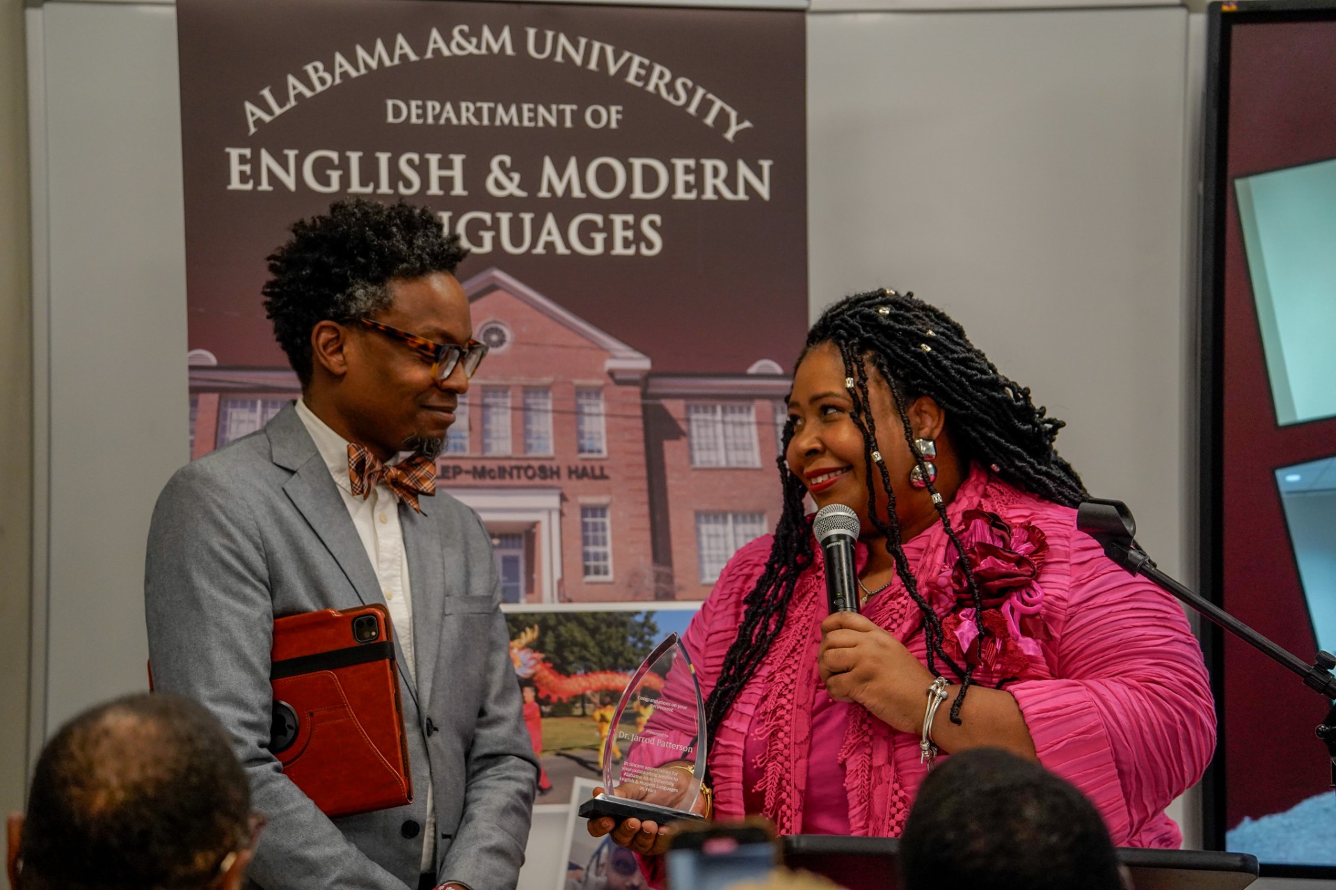 Dr. Teague Presents a Retirement Plaque to Dr. Jarrod Patterson 