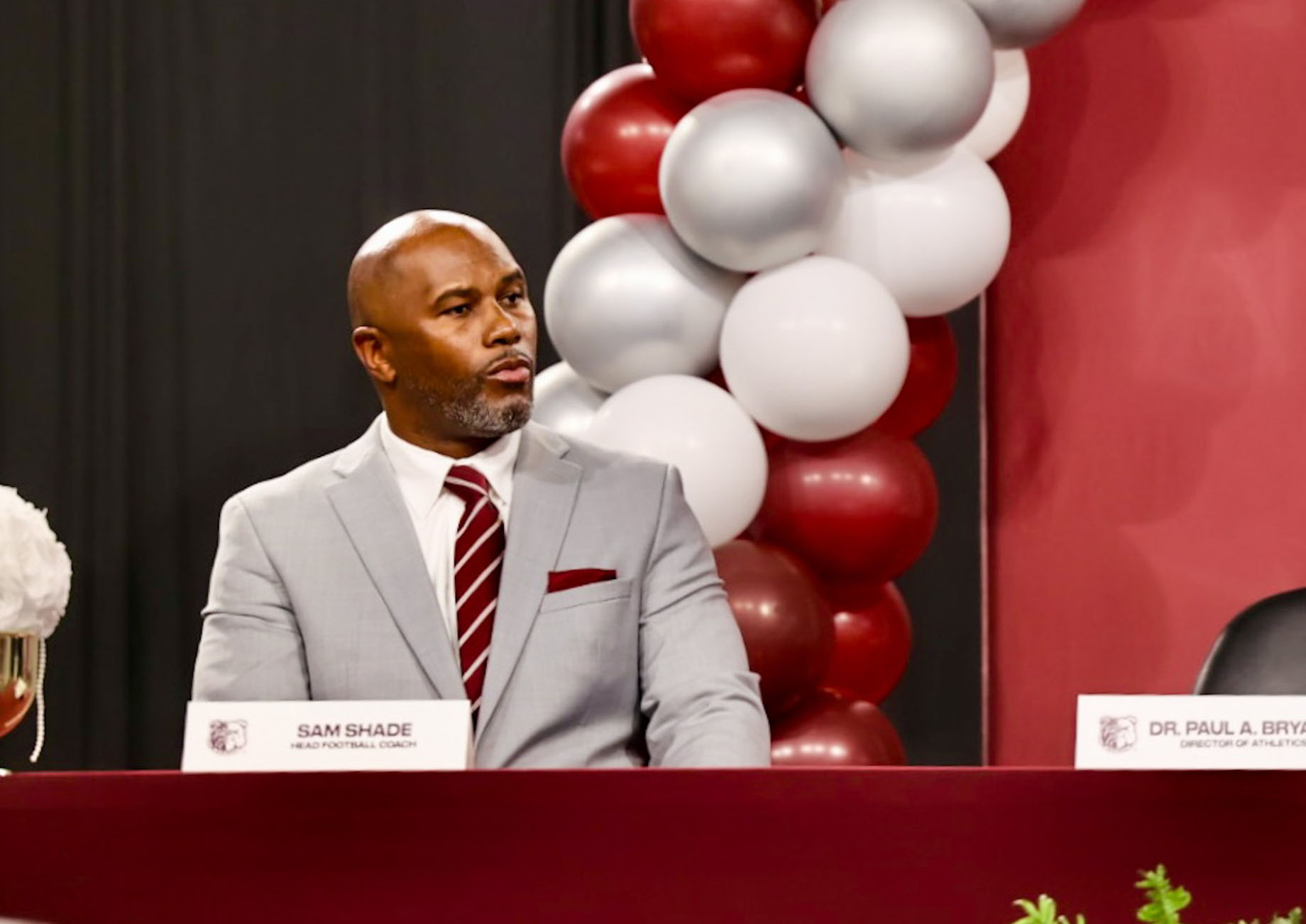 New AAMU Head Football Coach Sam Shade sits on stage as administrators introduce him during a news conference