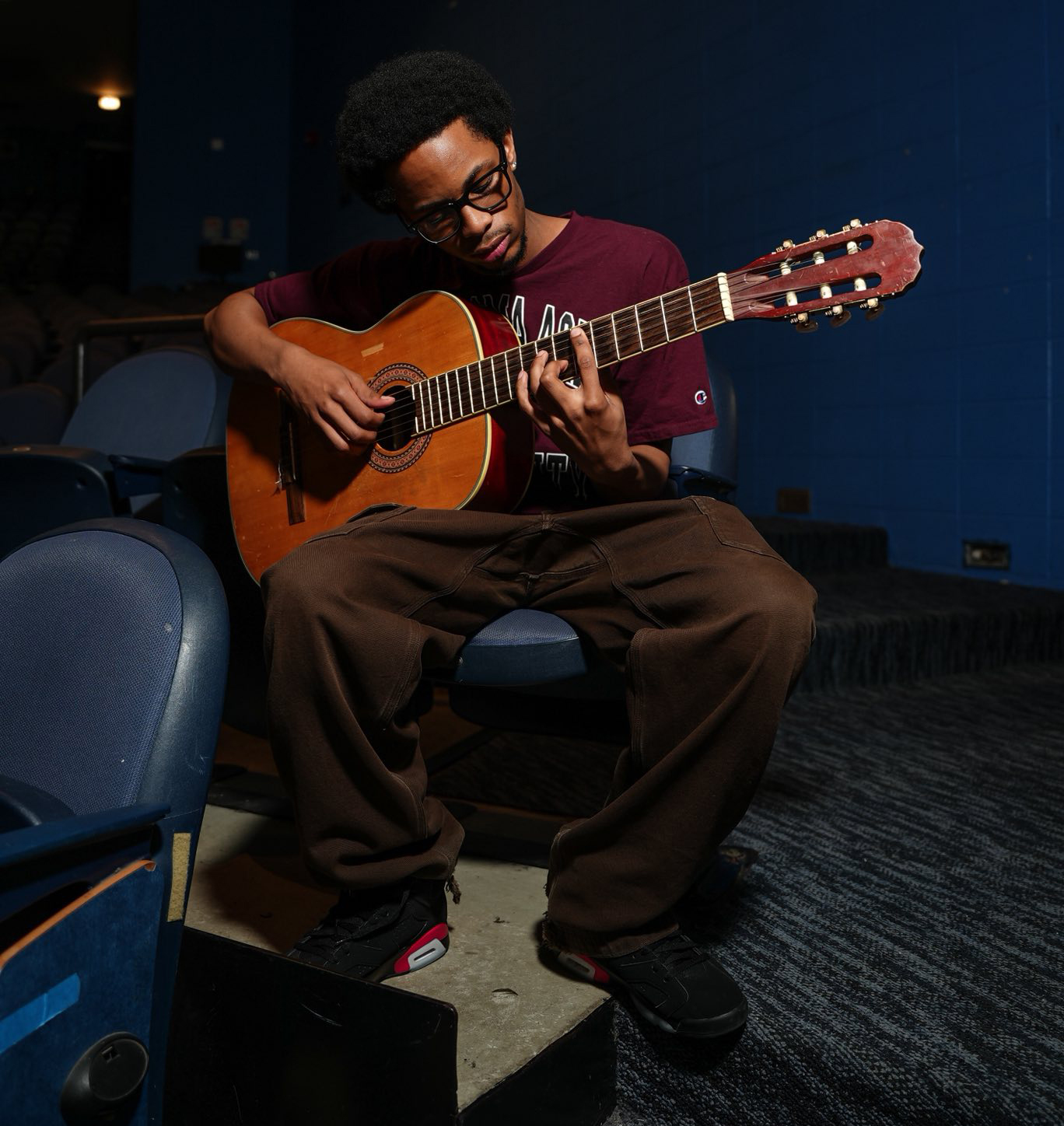 Lester Barrett plays guitar at Kenwood Academy Auditorium in Chicago