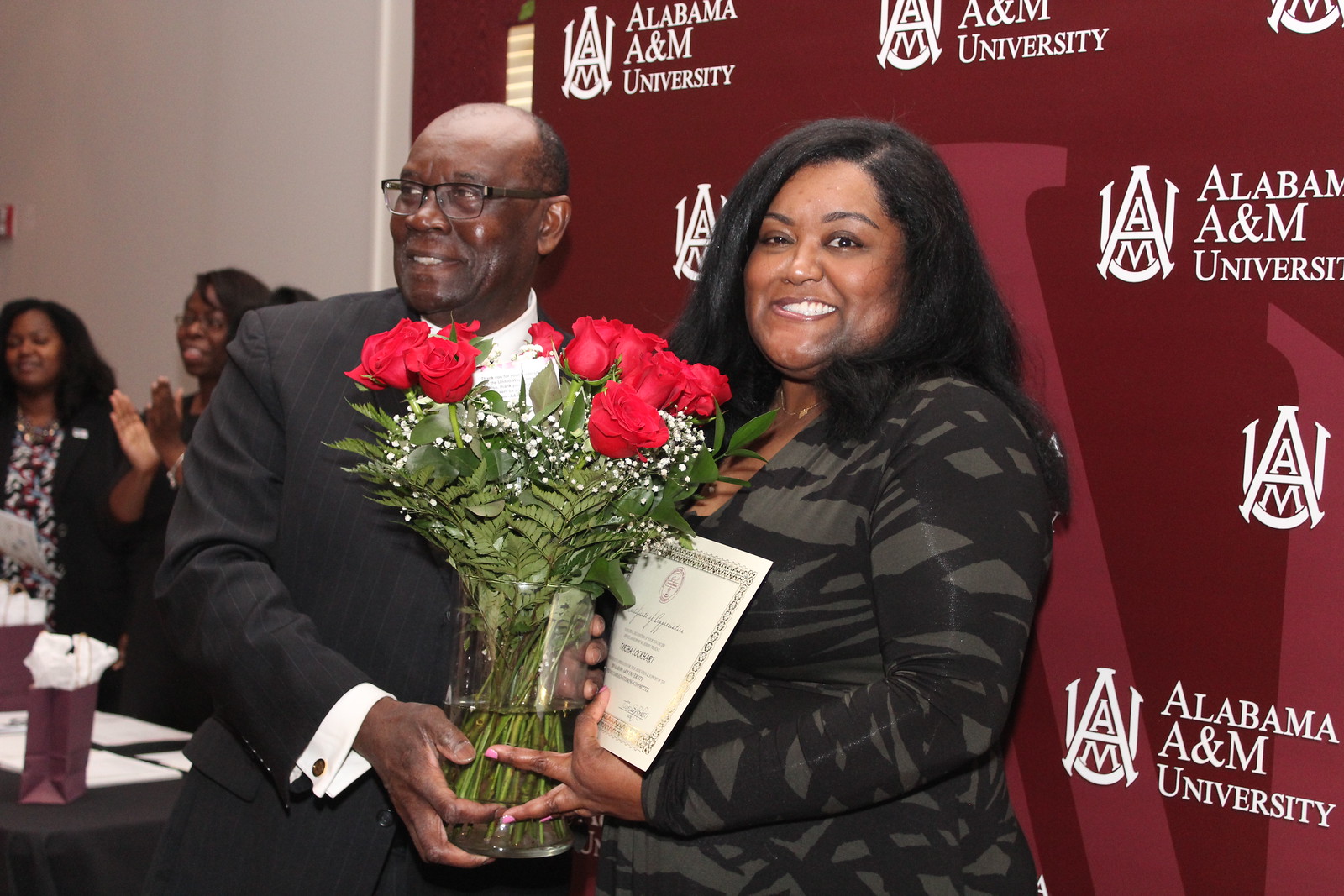 President Hugine thanks campus United Way coordinator Tarsha Lockhart for efforts