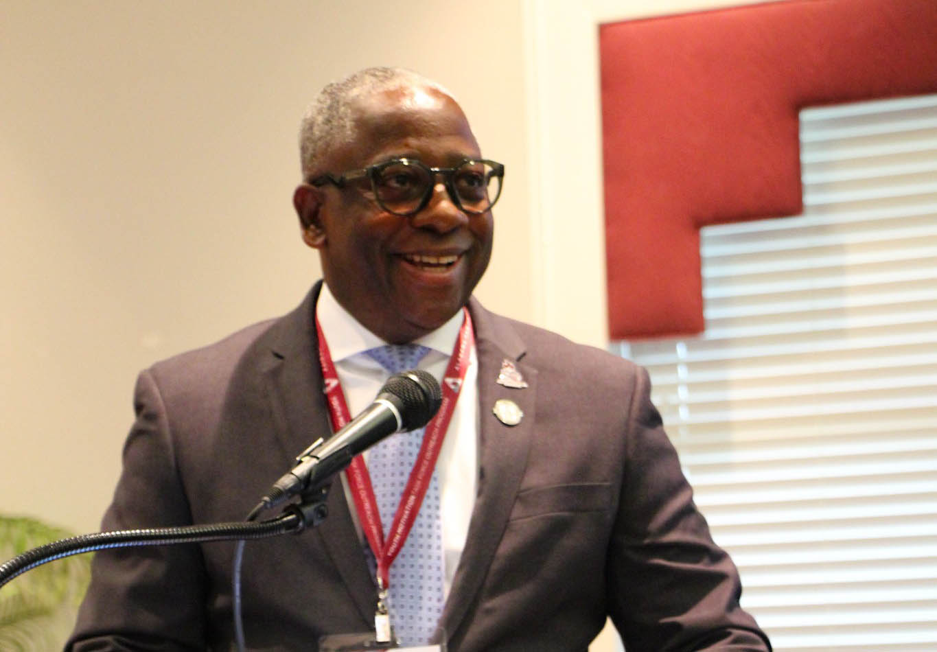 Sylvester C. Johnson at the podium during the YMTF Opening Session