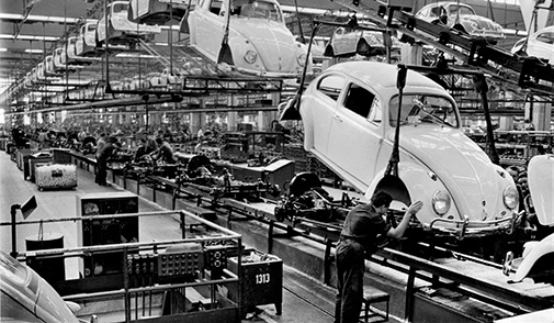 Volkswagen Beetle assembly line with worker