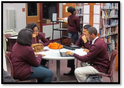 Students working together in a group at a table