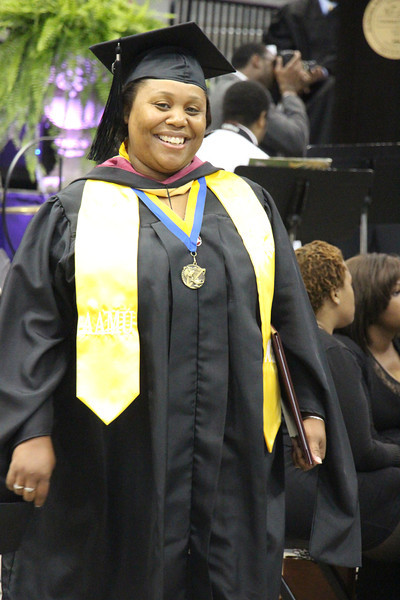 A smiling AAMU graduate