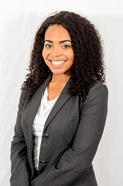 Female student dressed in grey sport coat