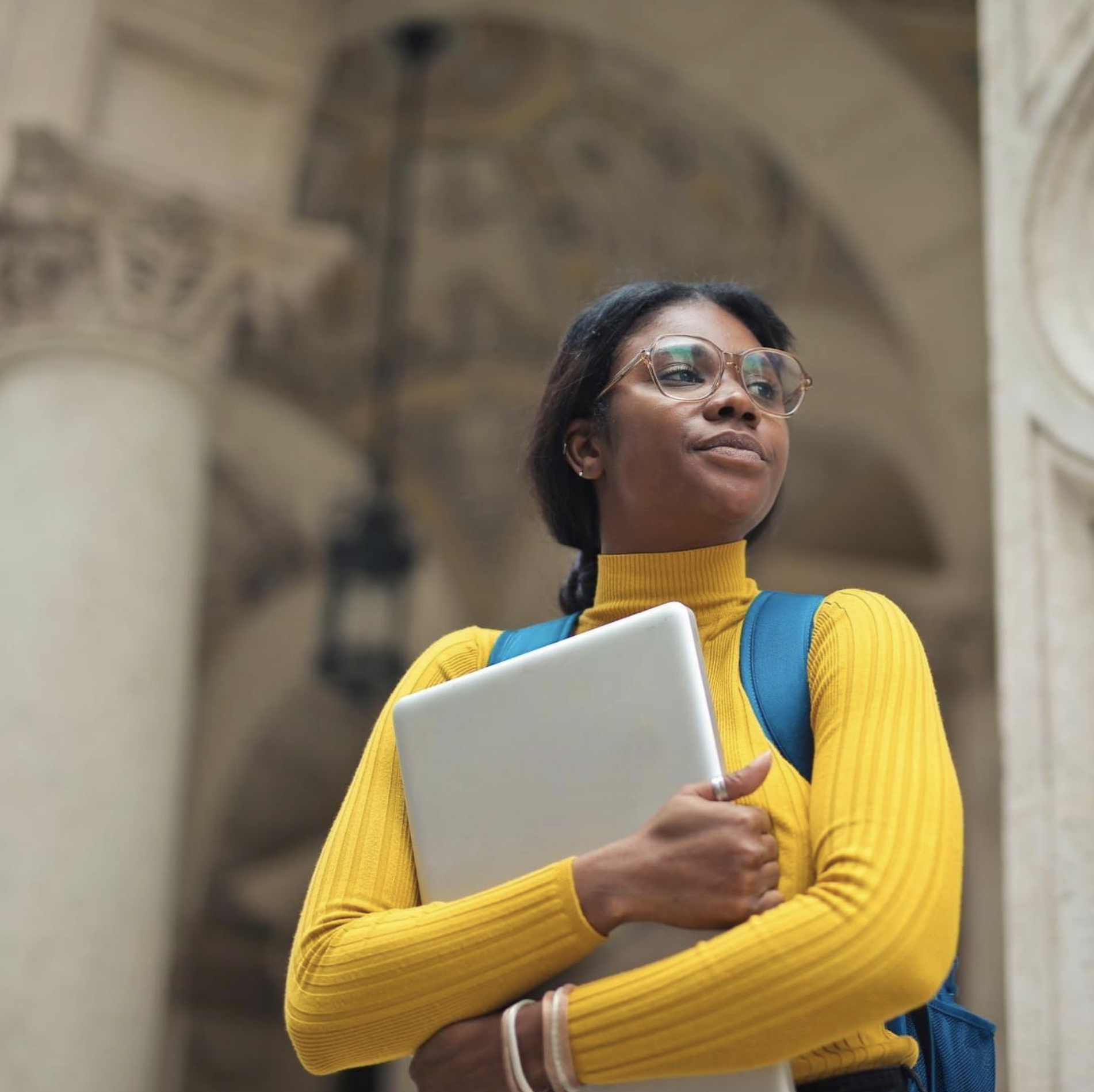 An AAMU student carrying a laptop